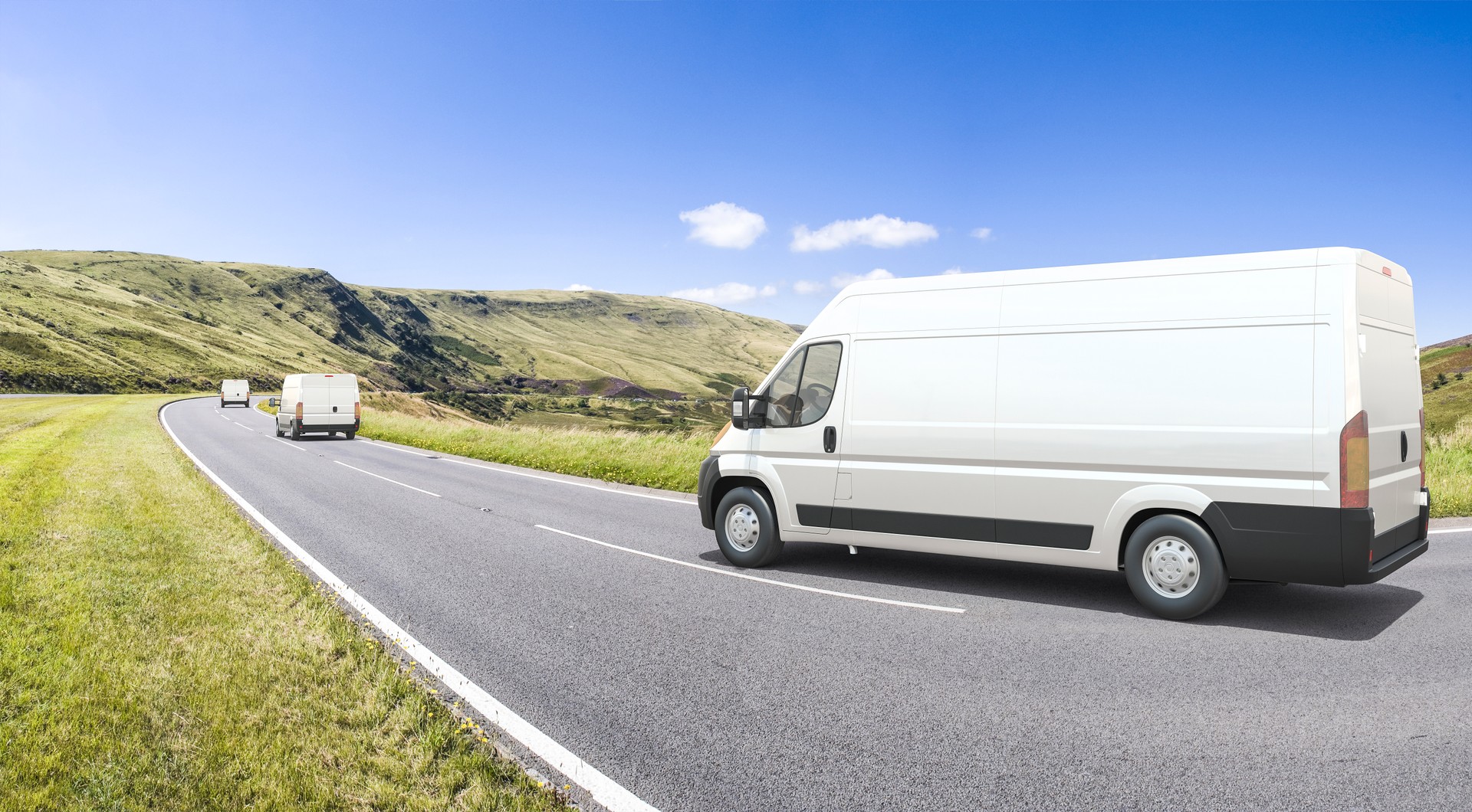 Multiple mini vans in motion on a colorful background